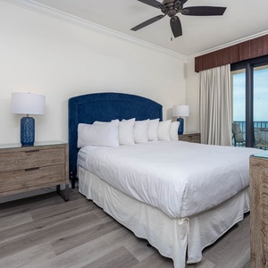 Serene master suite featuring a plush king bed, stylish decor, and direct access to the beach balcony