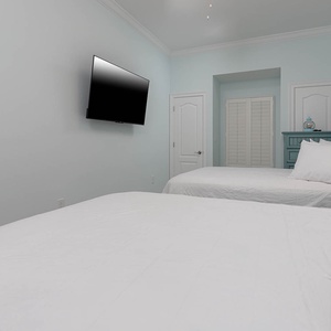 Unwind after a day at the beach and stream your favorite shows in the queen guest suite