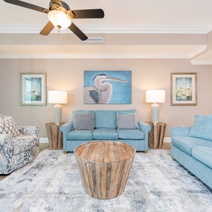 Unwind on the plush sofa with a queen sleeper, sharing stories and laughter while soaking in the inviting coastal vibe