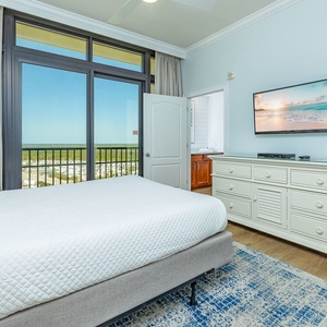 Relax on the cozy queen bed in this guest suite and stream your favorite shows after a beach day