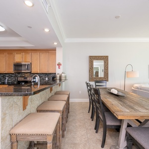 Enjoy a casual meal at the bar, surrounded by inviting decor and warm tones