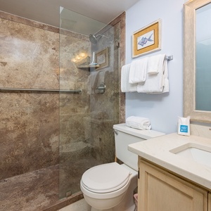 The master bath features a spacious walk-in shower, elegant fixtures, and a light color palette for a refreshing experience