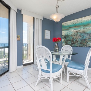 Enjoy meals at the glass dining table surrounded by bright decor and views that invite relaxation and conversation