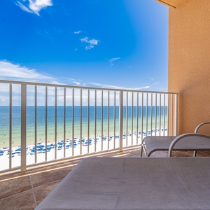 Relax on the balcony enjoying expansive views of the beach and sparkling gulf waters below