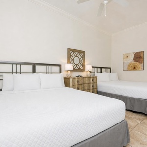 Relax in this queen guest suite, where soft bedding welcomes you for restful nights and gentle coastal vibes