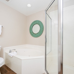 Refresh in the master bath after a day of adventure with a soothing jetted tub and relaxing walk-in shower