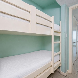 Bunk beds in the hallway offer a cozy spot for the kids after fun-filled days along the coast