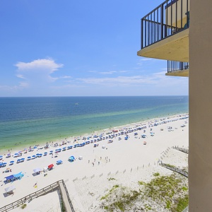 Enjoy stunning views from the balcony overlooking the vibrant beach, perfect for relaxation and enjoyment
