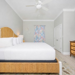 Unwind after a day at the beach with your favorite shows in this king bedroom