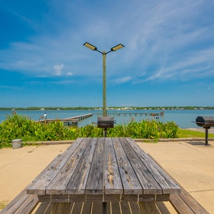 Lagoon-side barbecue grills and picnic tables, perfect for an easy outdoor meal