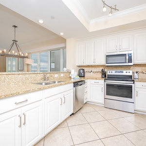 Create culinary delights in the stylish kitchen with stainless appliances and a stylish backsplash