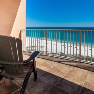 Breathe in the coastal air as you relax in comfortable chairs, soaking in breathtaking beach views from the balcony