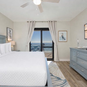 The master suite welcomes you to relax on a king bed with a tranquil gulf view from your balcony door