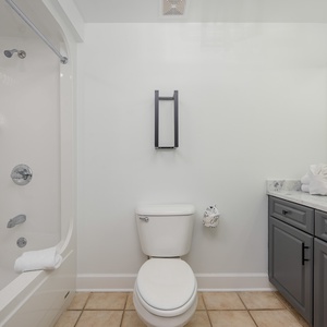 Freshen up in this guest bath in the relaxing shower or soothing tub before an exciting day