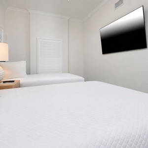 Unwind in this queen guest suite and stream your favorite shows or enjoy a good movie after a beach day