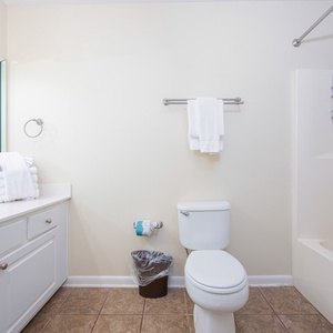 Refresh in this guest bathroom featuring a spacious vanity, ample towels, and soft lighting