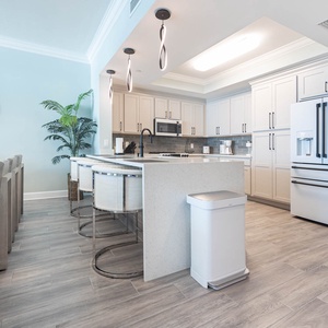 Savor your morning coffee under pendant lights and prep meals in this stylish kitchen