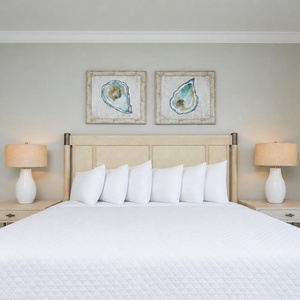Enjoy peaceful rest in the master bedroom featuring a king bed, soft linens, and stylish decor