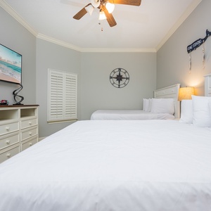 Unwind in this queen guest suite and stream your favorite shows or enjoy a good movie after a beach day