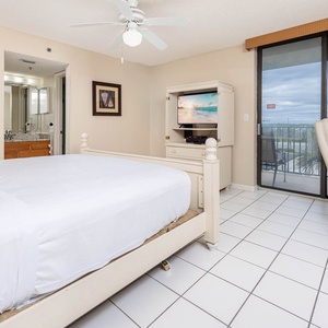 Master suite featuring a king bed, TV, workspace with complementary WiFi, en-suite bath, and a balcony