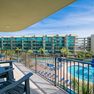 Relax on the spacious balcony, soaking in the vibrant atmosphere and views of the refreshing pool