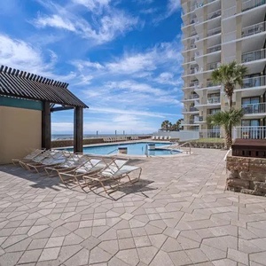 Lounge poolside with breathtaking beach views and easy access to amenities for a perfect getaway experience at Romar Place