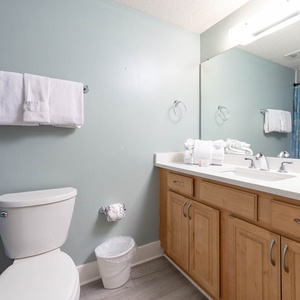 Refresh in the guest bathroom featuring a spacious vanity, relaxing tub-shower combination, and fresh towels