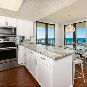 Prepare meals while enjoying the coastal views from the kitchen, where family traditions come to life