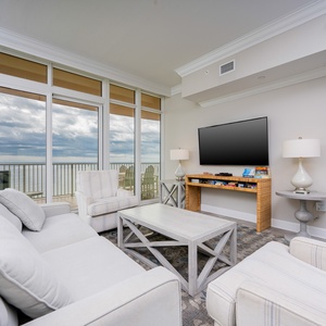 Unwind in the cozy living room, soaking up the stunning coastal views while streaming your favorite shows