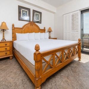 In the king master suite, you sink into crisp linens and enjoy peaceful moments beside patio doors