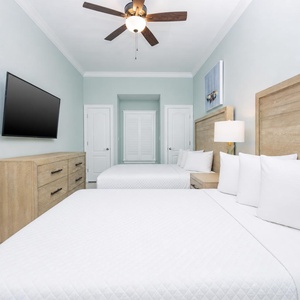 Unwind in this queen guest suite and stream your favorite shows or enjoy a good movie after a beach day