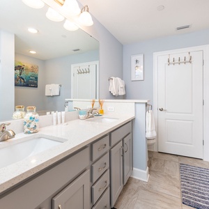 Refresh in the master bath after a day at the beach with a soothing jetted tub and relaxing walk-in shower