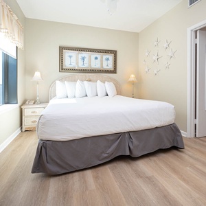 Unwind in this inviting guest bedroom featuring a king bed, soft lighting, and coastal decor for a restful retreat