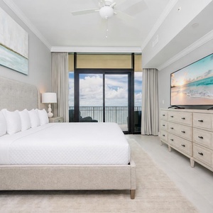 Unwind after a beach day in this king master suite with your favorite show and the sound of the waves