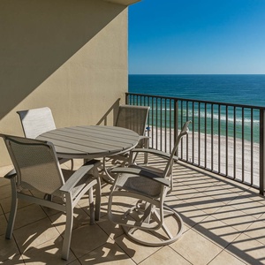 Relax on your balcony, taking in the vibrant coastal views as you cherish moments of serenity and connection