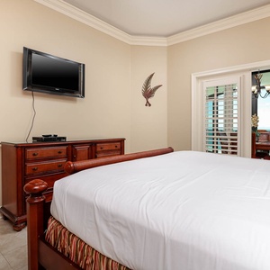Relax after a fun beach day and enjoy a movie from the cozy king bed in the master suite