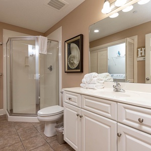 Refresh in this additional guest bath with a walk-in shower and laundry area with a washer and dryer in your rental