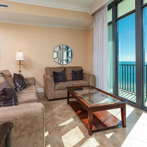 Relax on the sofa with a queen sleeper while soaking in breathtaking coastal views from the balcony