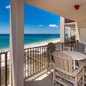 Evening breezes cool your skin as you relax around the table on your beach front balcony