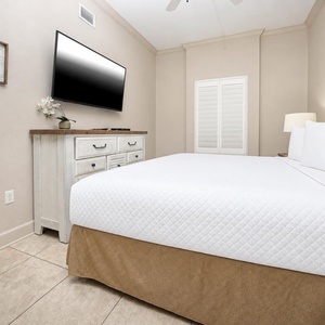 Sink into the king bed in this guest room and enjoy your favorite shows, embracing comfort and relaxation