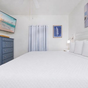 Calm blue tones and gentle lighting frame the master suite for peaceful rest and streaming your favorite show