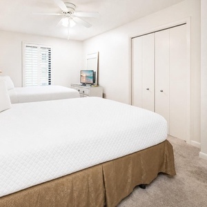 Unwind in this queen guest suite, enjoying restful nights on soft bedding with plenty of natural light streaming in