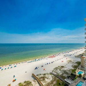 Enjoy breathtaking views of the vibrant beach and clear waters, perfect for relaxation and seaside activities