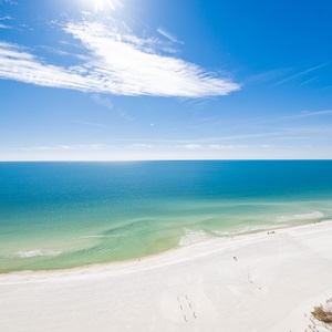 Experience the tranquil vibe from your balcony, watching waves meet the shore while soaking in the sunny skies