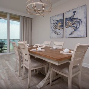 Settle into the dining chairs, then step onto the balcony to hear the gulf and watch the shore