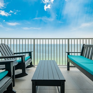 Relax in the comfortable seating on the balcony, taking in expansive views of the tranquil waters and blue sky