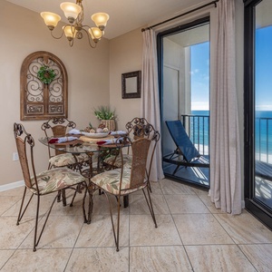 Dine at the round table while enjoying the refreshing breeze and beautiful views from the sliding glass doors