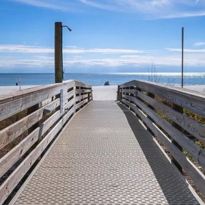 Walk along the boardwalk to discover stunning beachfront views and easy access to the soft sandy shore from Romar Place