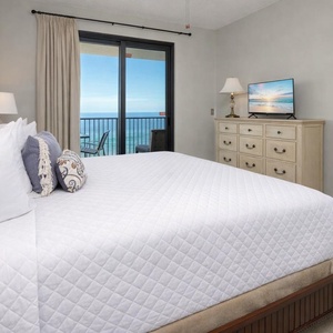 Enjoy a restful slumber in the king master suite, ready to awaken to sweeping coastal views from your balcony
