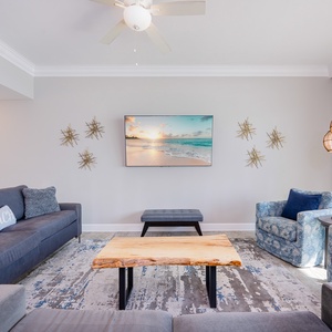Settle into the deep sofa, sip coffee, and stream shows on the wall TV with stunning beach views